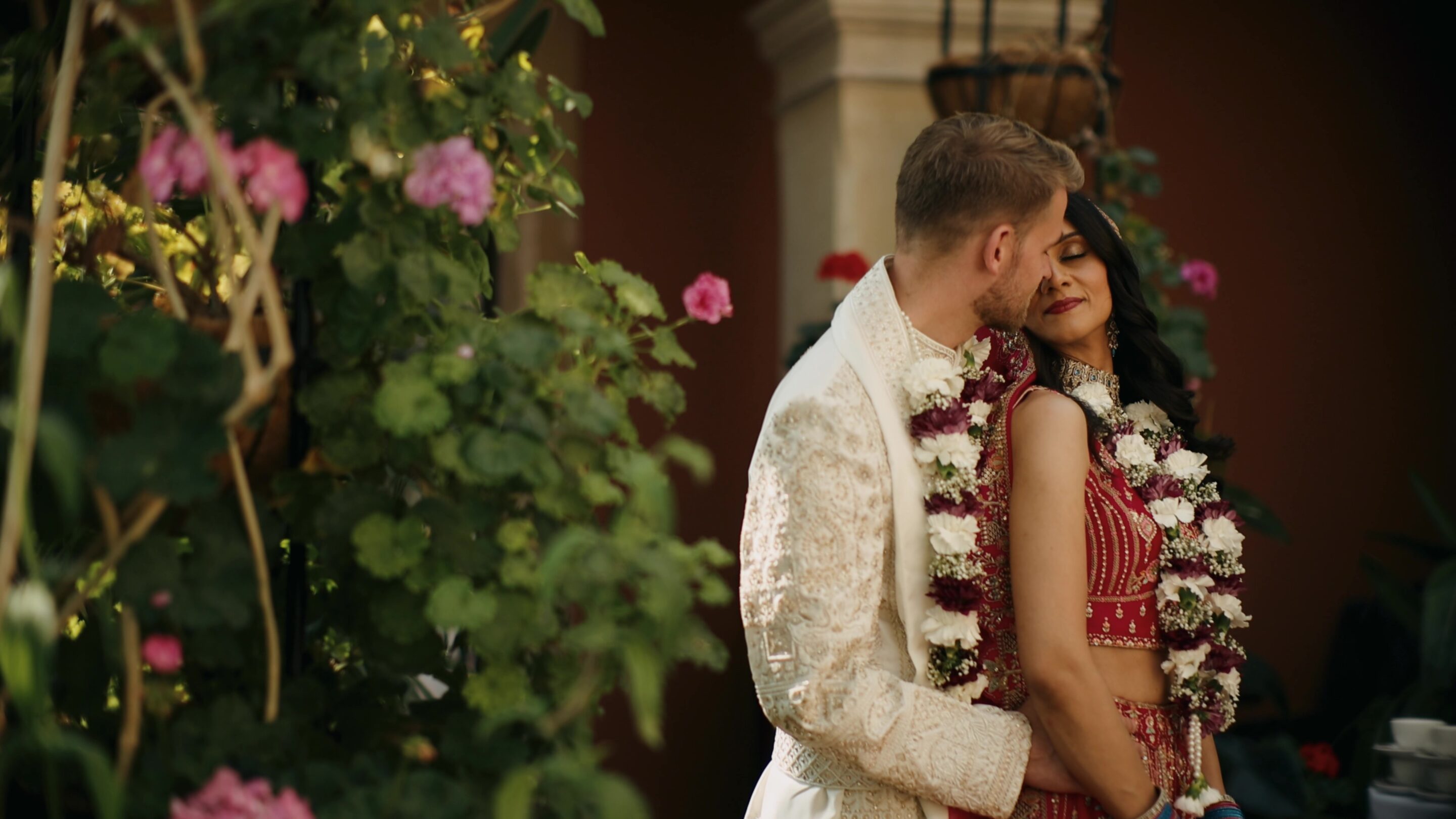 cinematic wedding videographer filming a couple during portraits
