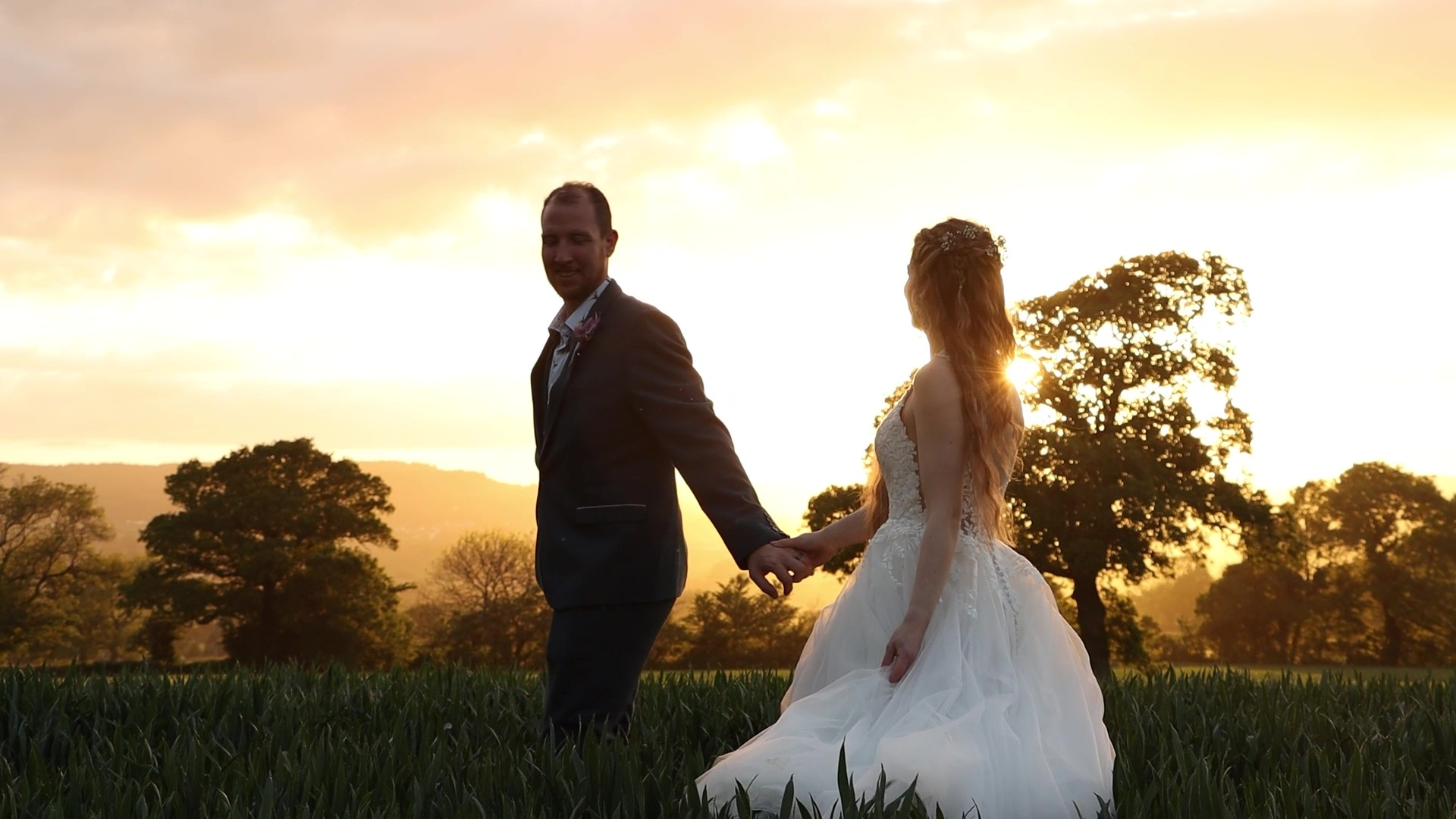Bride and groom walking at a UK wedding filmed by a professional videographer