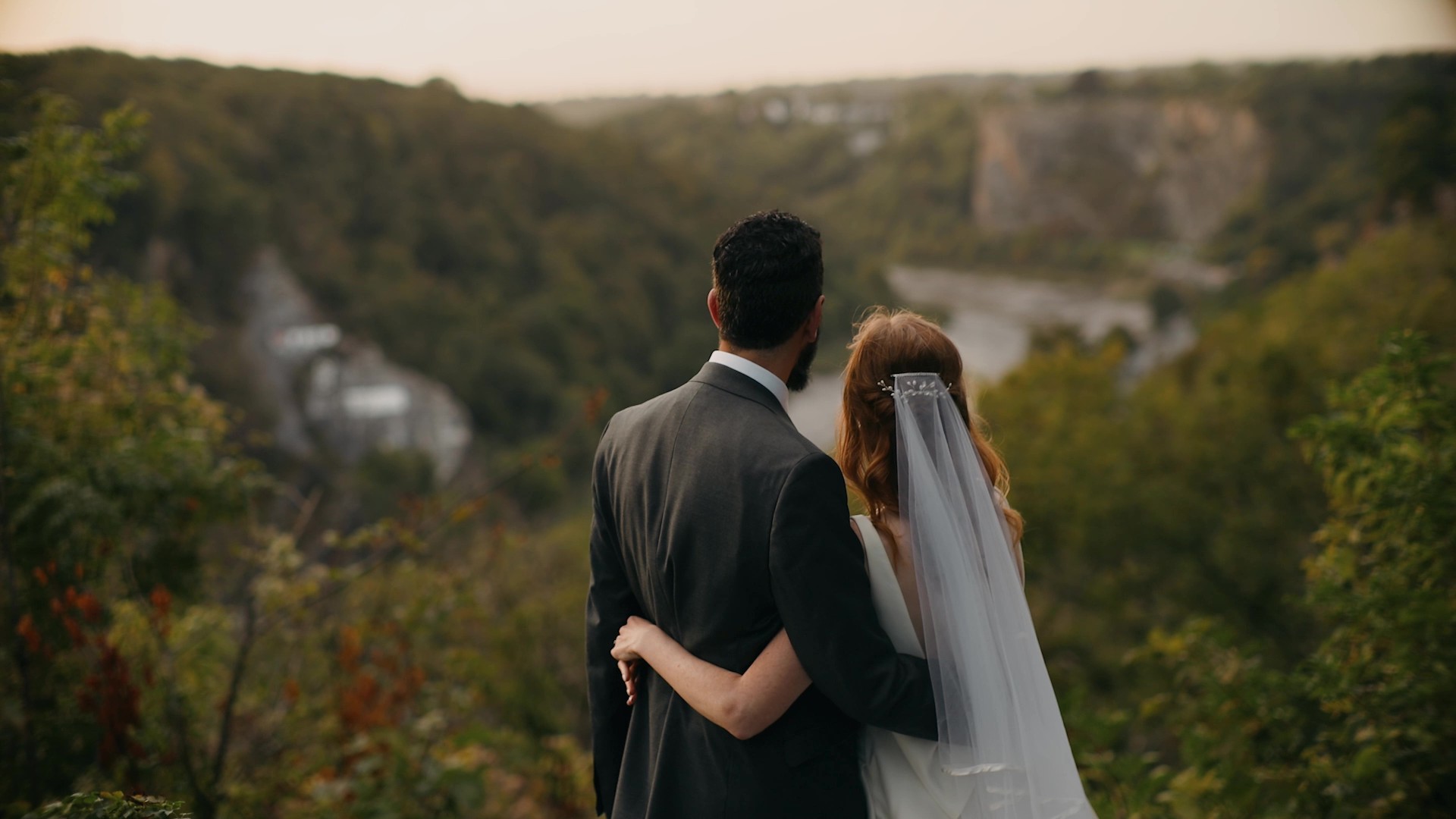 Couple walking by The Downs captured in cinematic wedding film