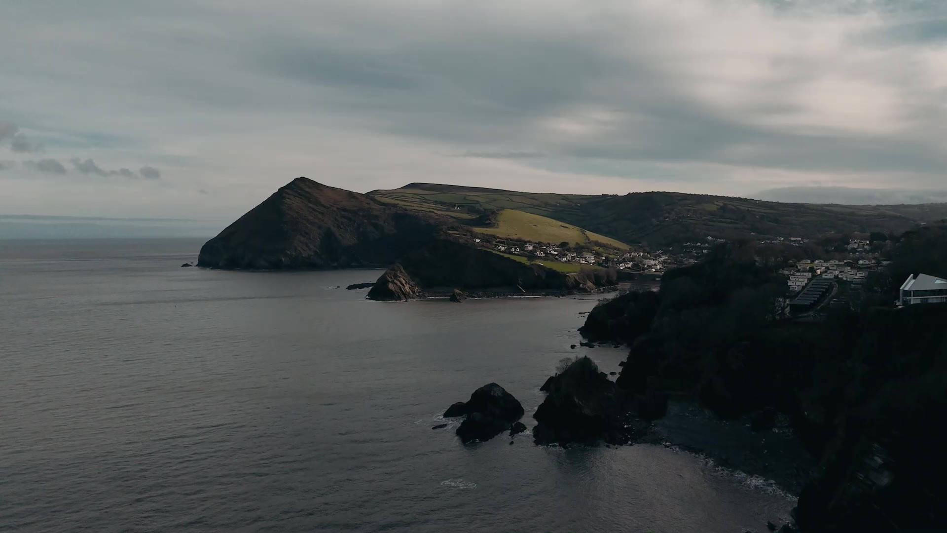 Sunset wedding film shot on Devon coast with iconic landscape
